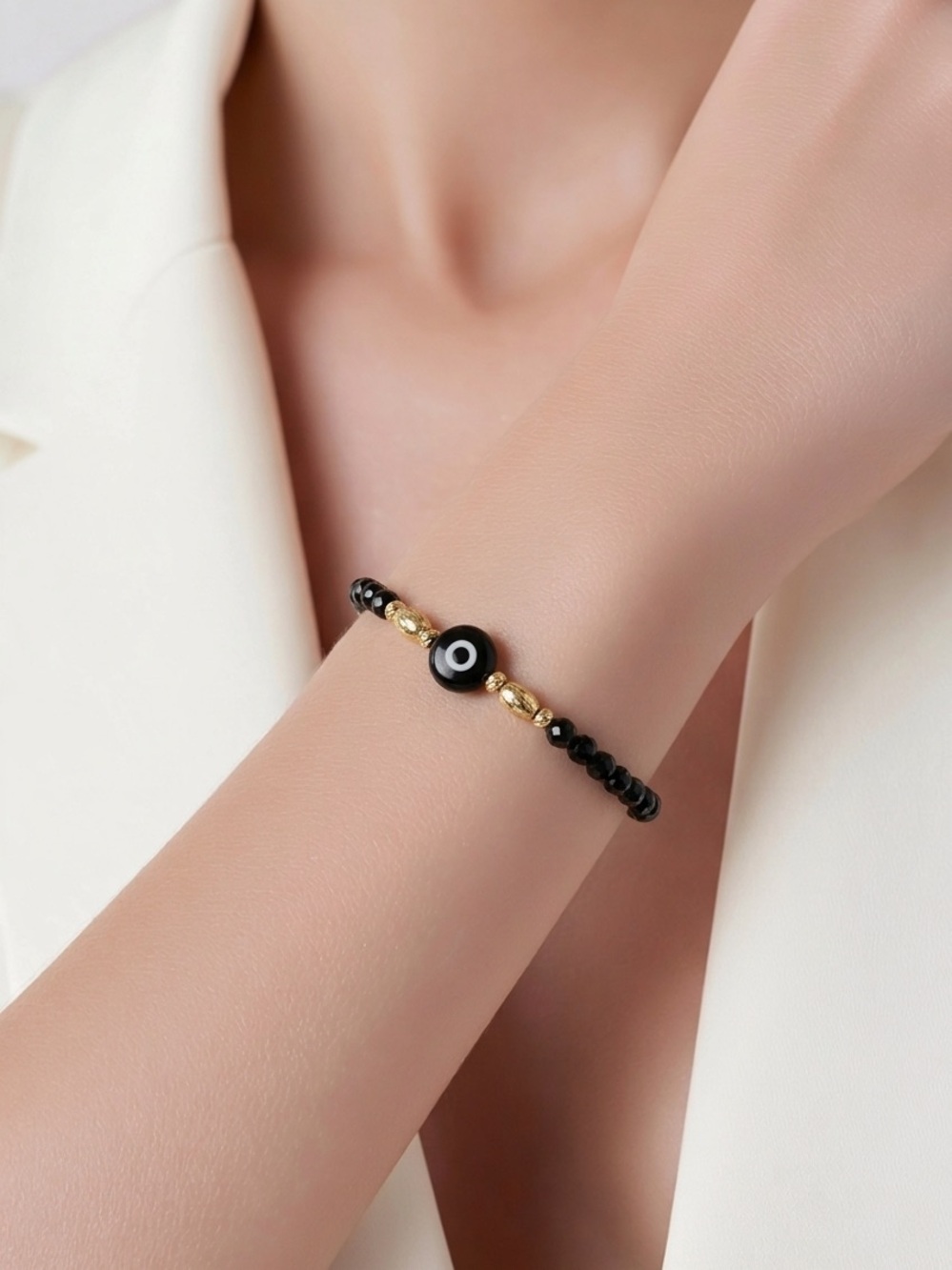 Black Evil Eye elastic Bracelet with gold filled beads